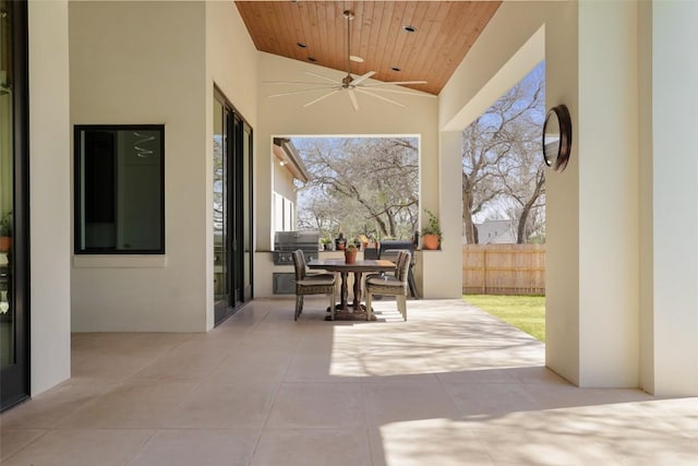 4704 Timberline Dr, Austin, TX 78746 - view of patio featuring a ceiling fan, area for grilling, outdoor dining area, fence, and grilling area