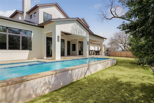 4704 Timberline Dr, Austin, TX 78746 - rear view of house featuring stucco siding, a patio area, a ceiling fan, and a chimney