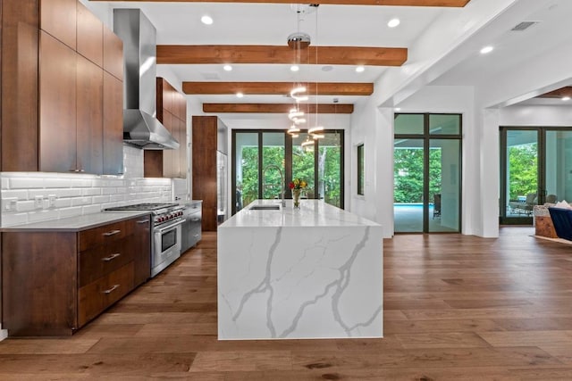 4704 Timberline Dr, Austin, TX 78746 - kitchen featuring high end stainless steel range, modern cabinets, tasteful backsplash, beam ceiling, and wall chimney range hood