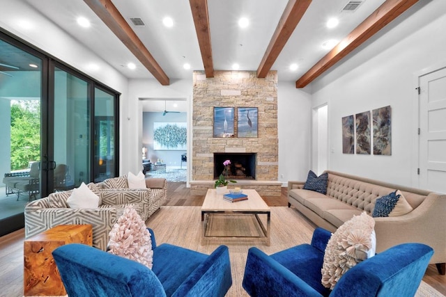 4704 Timberline Dr, Austin, TX 78746 - living area featuring wood finished floors, beamed ceiling, recessed lighting, and a stone fireplace