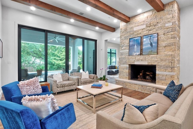 4704 Timberline Dr, Austin, TX 78746 - living area with wood finished floors, beamed ceiling, a stone fireplace, and ceiling fan