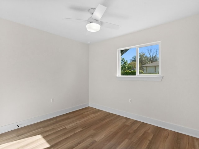 5416 Coventry Ln, Austin, TX 78723 - empty room with wood finished floors, baseboards, and a ceiling fan