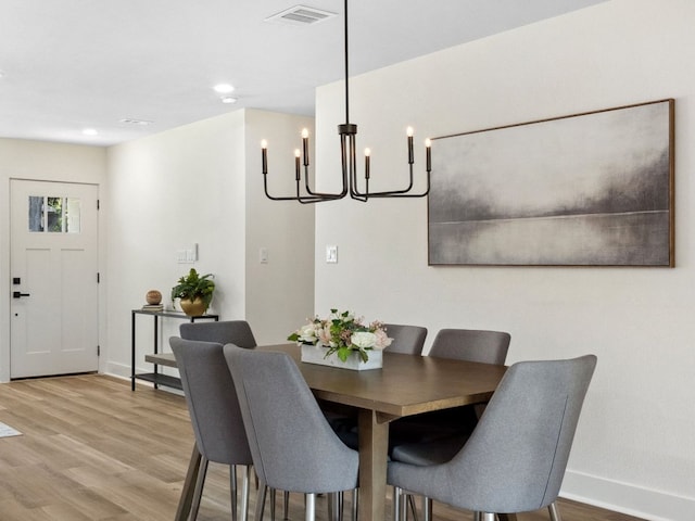 5416 Coventry Ln, Austin, TX 78723 - dining space featuring a chandelier, baseboards, wood finished floors, and recessed lighting