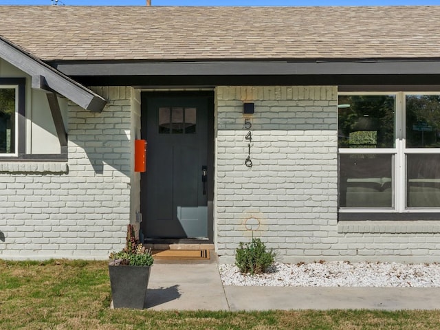 5416 Coventry Ln, Austin, TX 78723 - property entrance featuring a shingled roof and brick siding