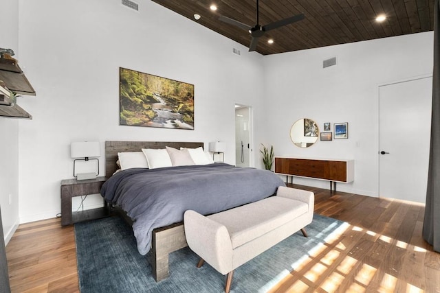 1411 Haskell St, Austin, TX 78702 - bedroom featuring wooden ceiling, wood finished floors, a high ceiling, and recessed lighting