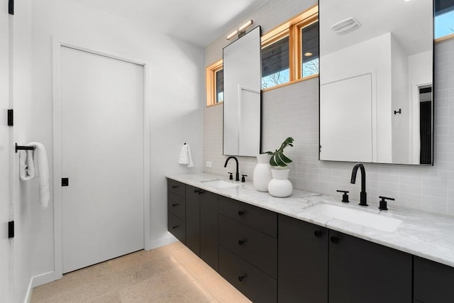 1411 Haskell St, Austin, TX 78702 - bathroom featuring double vanity and decorative backsplash