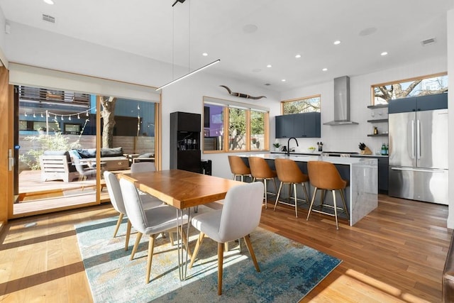 1411 Haskell St, Austin, TX 78702 - dining area featuring light wood finished floors and recessed lighting