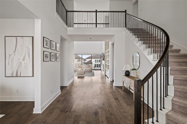 1005 Trevi Fontana, Leander, TX 78641 - entrance foyer featuring dark wood finished floors, stairs, and a high ceiling