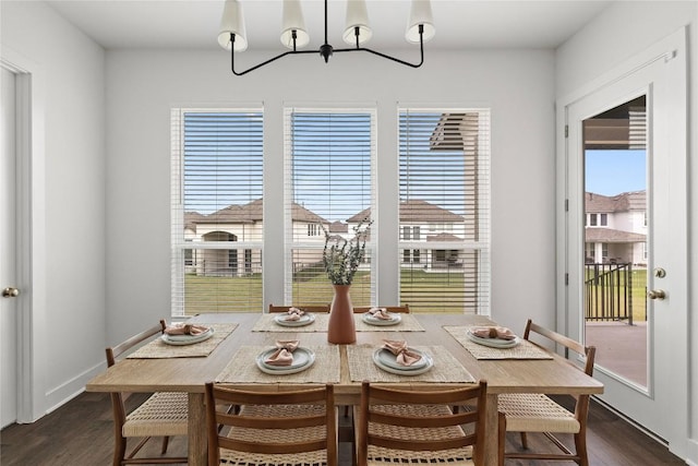 1005 Trevi Fontana, Leander, TX 78641 - dining area featuring dark wood finished floors and a chandelier