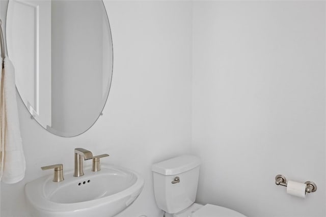 1005 Trevi Fontana, Leander, TX 78641 - half bathroom featuring a sink and toilet