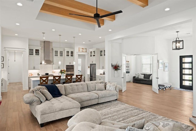 425 Private Road 915, Georgetown, TX 78633 - living area with recessed lighting, light wood-style flooring, a high ceiling, and a tray ceiling