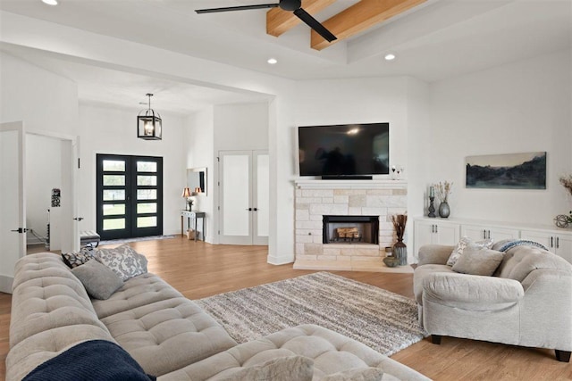 425 Private Road 915, Georgetown, TX 78633 - living area featuring french doors, recessed lighting, beamed ceiling, ceiling fan with notable chandelier, and wood finished floors