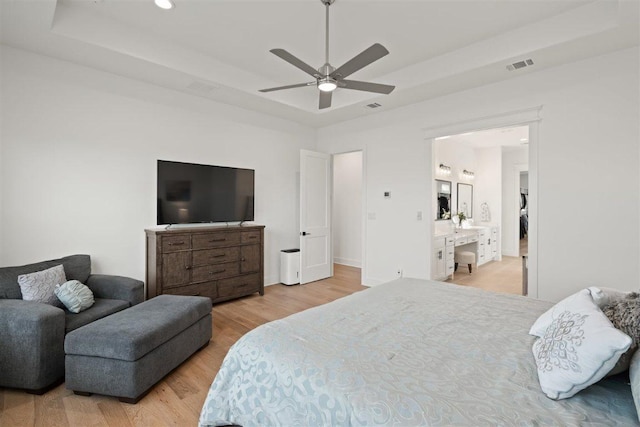 425 Private Road 915, Georgetown, TX 78633 - bedroom featuring visible vents, wood finished floors, a tray ceiling, and ceiling fan