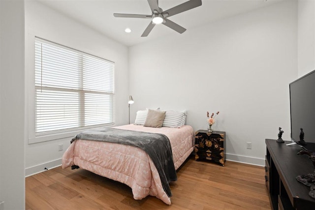 425 Private Road 915, Georgetown, TX 78633 - bedroom featuring baseboards, recessed lighting, light wood-style floors, and multiple windows