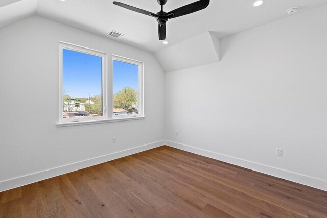 710 Philco Dr, Austin, TX 78745 - bonus room featuring vaulted ceiling, a ceiling fan, baseboards, dark wood finished floors, and recessed lighting
