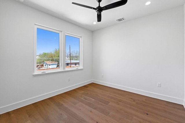 710 Philco Dr, Austin, TX 78745 - unfurnished room with baseboards, wood finished floors, ceiling fan, and recessed lighting