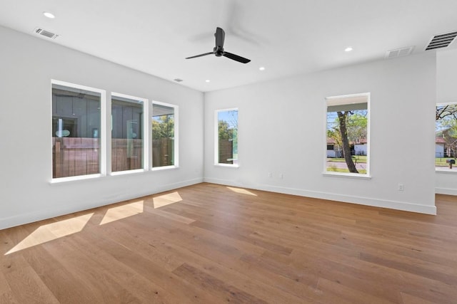 710 Philco Dr, Austin, TX 78745 - empty room with wood finished floors, a ceiling fan, baseboards, and recessed lighting