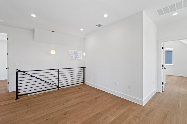 710 Philco Dr, Austin, TX 78745 - unfurnished room featuring wood finished floors, baseboards, and recessed lighting