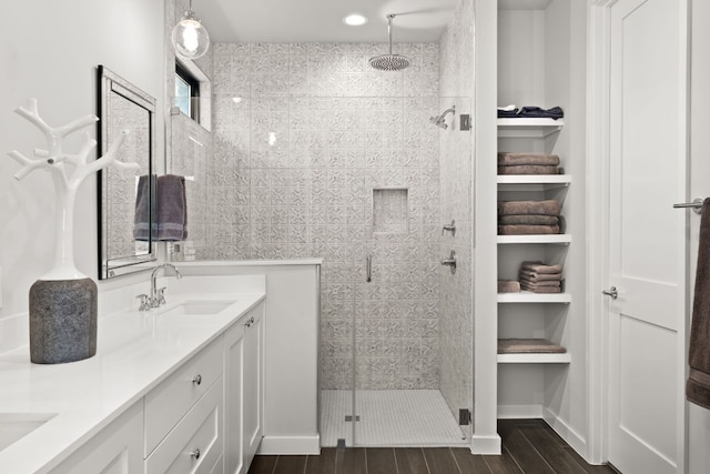 316 Hidden Beacon Bnd, Lakeway, TX 78738 - full bath featuring a stall shower, double vanity, and wood finished floors