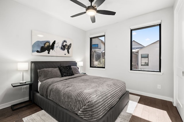 316 Hidden Beacon Bnd, Lakeway, TX 78738 - bedroom with baseboards, wood finished floors, multiple windows, and a ceiling fan