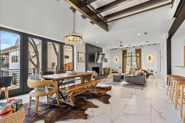 1905 Big Horn Dr, Austin, TX 78734 - dining room with french doors, light marble finish flooring, a tile fireplace, a ceiling fan, and recessed lighting