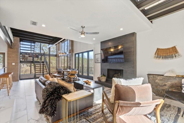 1905 Big Horn Dr, Austin, TX 78734 - living area with ceiling fan, marble look tile flooring, recessed lighting, a fireplace, and a high ceiling
