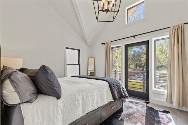 1905 Big Horn Dr, Austin, TX 78734 - bedroom featuring multiple windows, a chandelier, high vaulted ceiling, and access to exterior