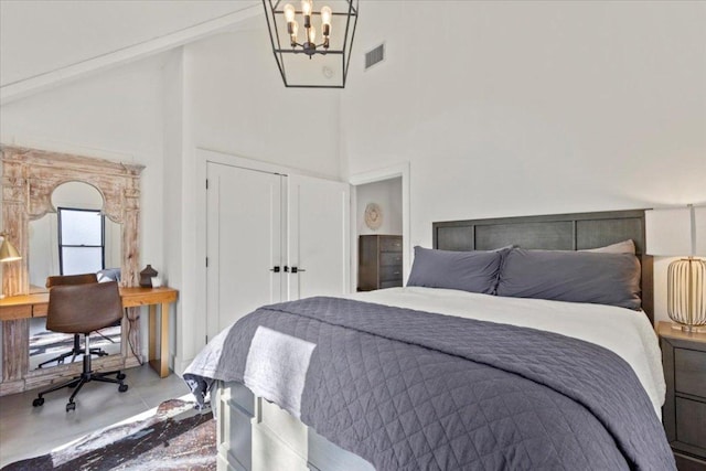 1905 Big Horn Dr, Austin, TX 78734 - bedroom with a high ceiling, a chandelier, finished concrete floors, a desk, and a closet