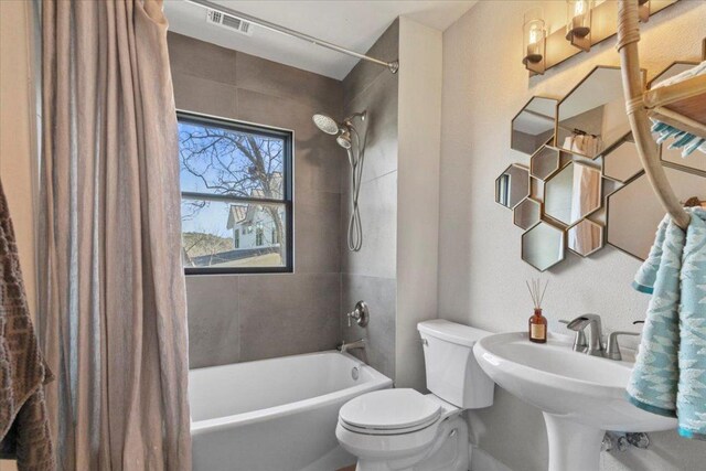 1905 Big Horn Dr, Austin, TX 78734 - bathroom with toilet, shower / bath combination with curtain, and a sink