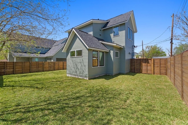 4525 S 3rd St, Austin, TX 78745 - rear view of property featuring a shingled roof and a fenced backyard