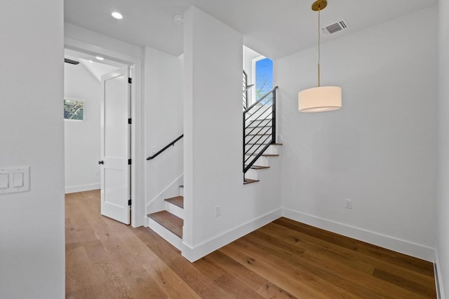 4525 S 3rd St, Austin, TX 78745 - stairs with wood finished floors and recessed lighting