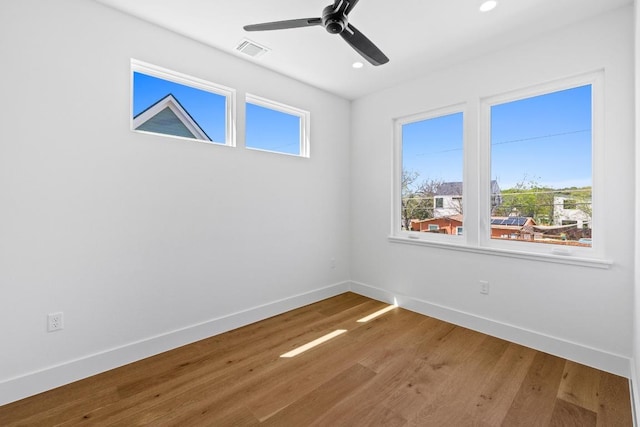 4525 S 3rd St, Austin, TX 78745 - unfurnished room with wood finished floors, a ceiling fan, and recessed lighting