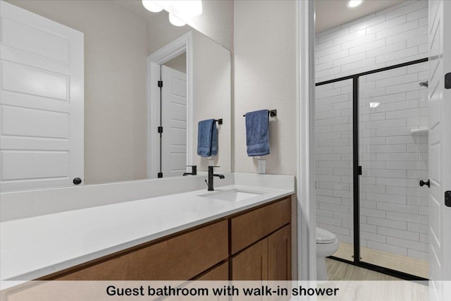 145 Gaston Dr, Bastrop, TX 78602 - bathroom with toilet, a shower stall, and vanity