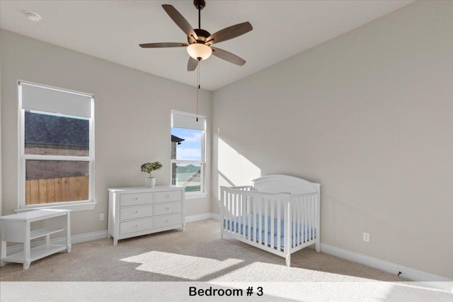 145 Gaston Dr, Bastrop, TX 78602 - bedroom with carpet, baseboards, and a nursery area