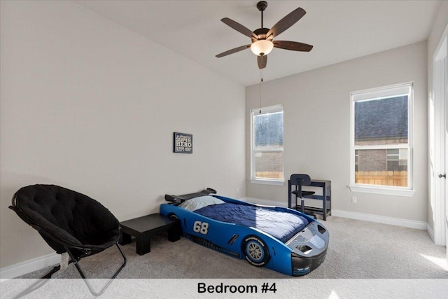 145 Gaston Dr, Bastrop, TX 78602 - bedroom with baseboards, a ceiling fan, and carpet floors