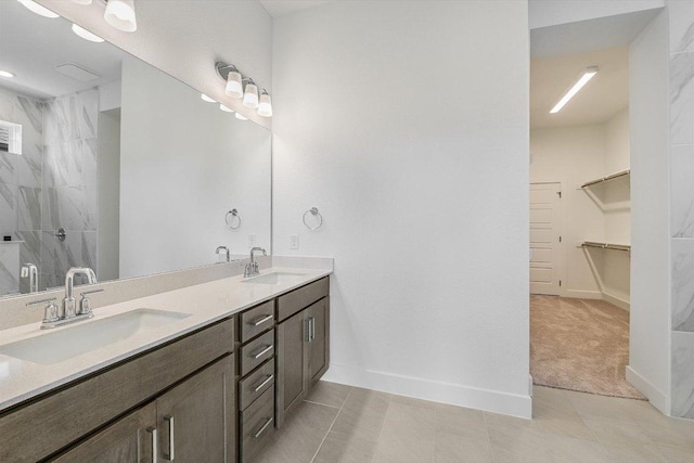 1405 S Brook Dr, Leander, TX 78641 - bathroom featuring double vanity, a shower, and a walk in closet
