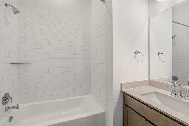 1405 S Brook Dr, Leander, TX 78641 - bathroom featuring shower / bath combination, vanity, and a textured wall