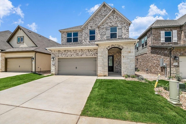 1405 S Brook Dr, Leander, TX 78641 - view of front of home with a front lawn, concrete driveway, an attached garage, and stucco siding