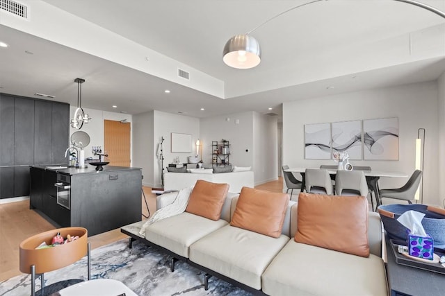 44 E Ave Unit 3402, Austin, TX 78701 - living area with recessed lighting and light wood-type flooring