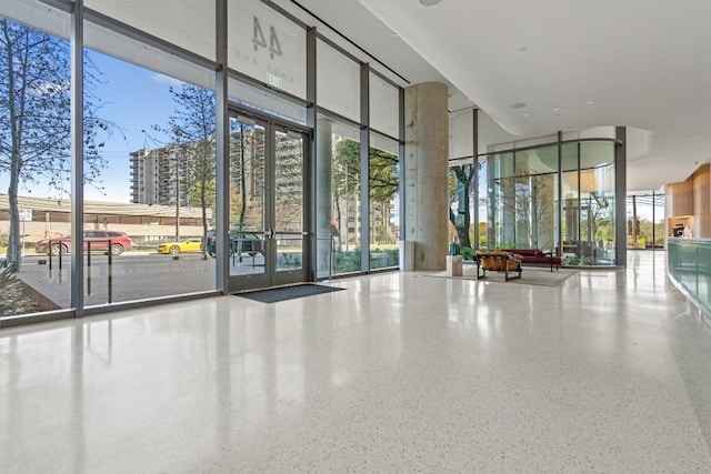 44 E Ave Unit 3402, Austin, TX 78701 - building lobby featuring a wall of windows and a towering ceiling