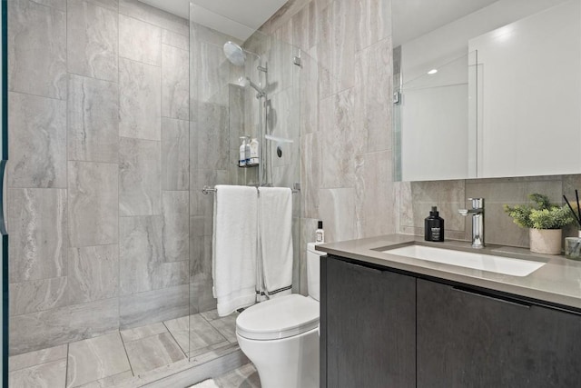 44 E Ave Unit 3402, Austin, TX 78701 - full bath with vanity, walk in shower, toilet, tile walls, and backsplash