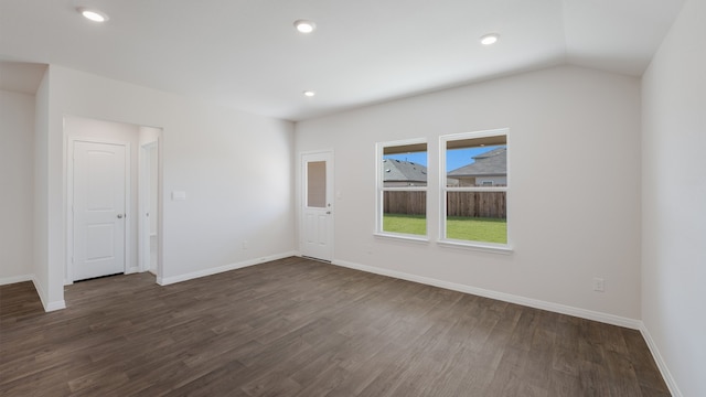 empty room with baseboards, recessed lighting, and dark wood-style floors