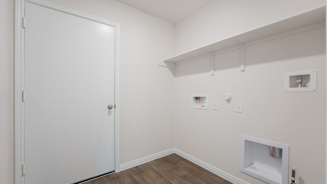 clothes washing area featuring gas dryer hookup, laundry area, baseboards, dark wood-style floors, and hookup for a washing machine