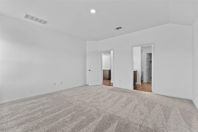 130 Carmello, Kyle, TX 78640 - unfurnished bedroom featuring carpet flooring, connected bathroom, and recessed lighting