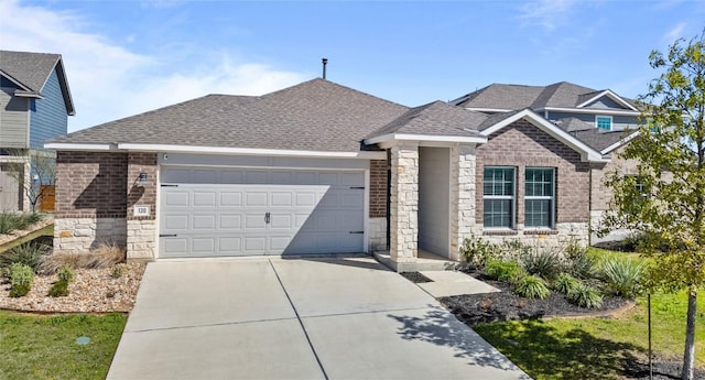 130 Carmello, Kyle, TX 78640 - view of front of house with stone siding, an attached garage, and driveway