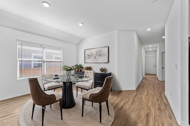 130 Carmello, Kyle, TX 78640 - dining space featuring light wood-type flooring, lofted ceiling, and recessed lighting