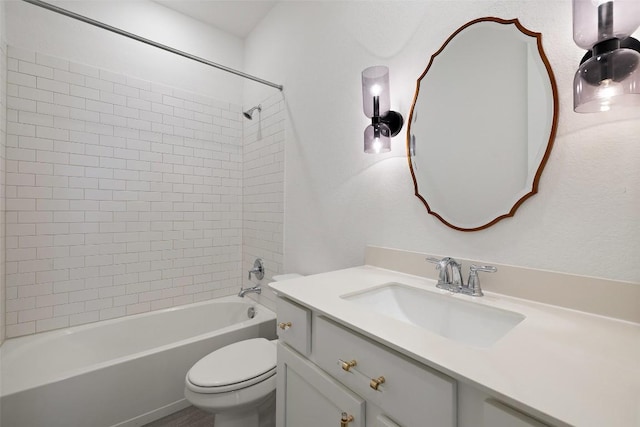 bathroom featuring shower / washtub combination, toilet, and vanity