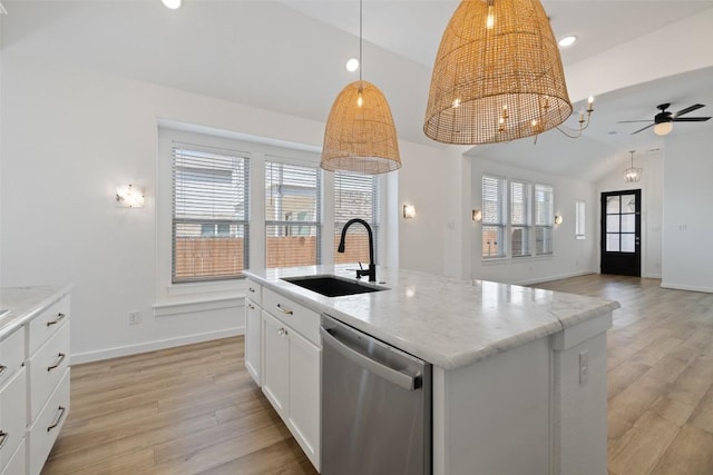 kitchen with stainless steel dishwasher, lofted ceiling, light wood-style floors, and a sink