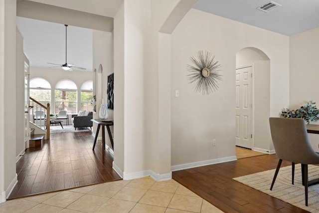 2701 Blackstone Cv, Round Rock, TX 78665 - entryway with arched walkways, ceiling fan, wood finished floors, and baseboards
