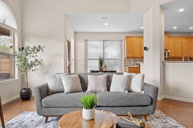 2701 Blackstone Cv, Round Rock, TX 78665 - living area featuring light wood-type flooring, plenty of natural light, recessed lighting, and baseboards